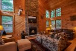 Gorgeous gas, stone fireplace to warm by